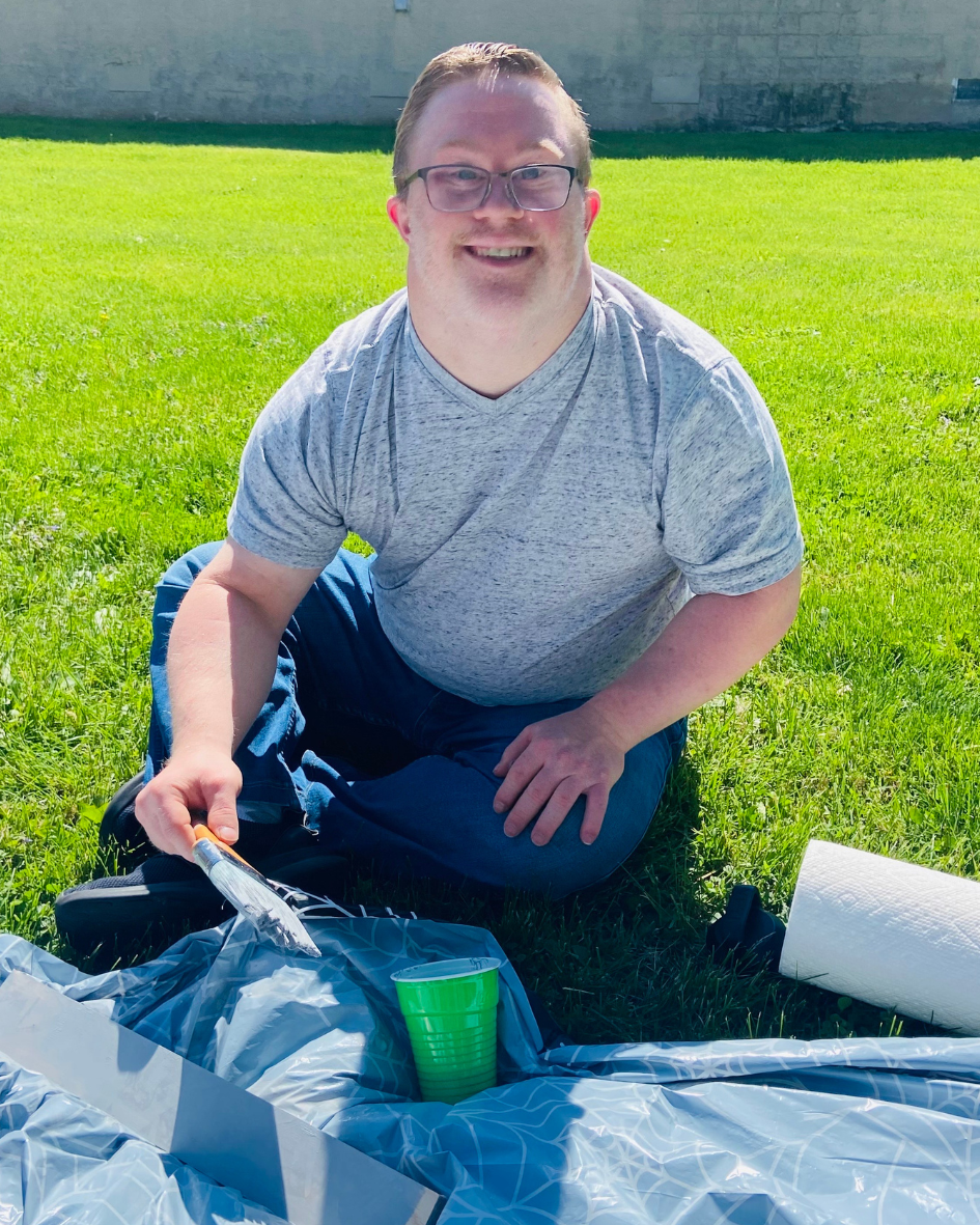 John smiling for the camera painting